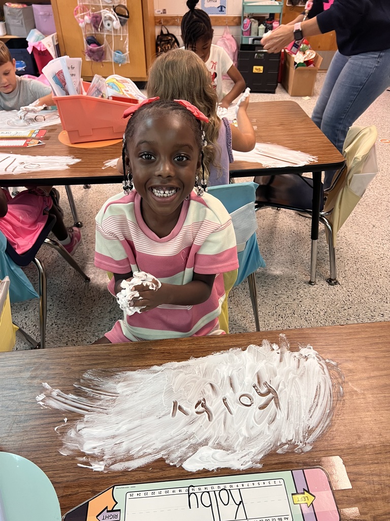 Webster's Kindergarten class enjoying snow cones and writing their names in shaving cream.