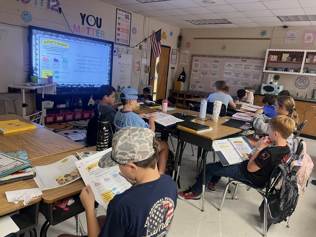 Omega Elementary students practing literacy skills.