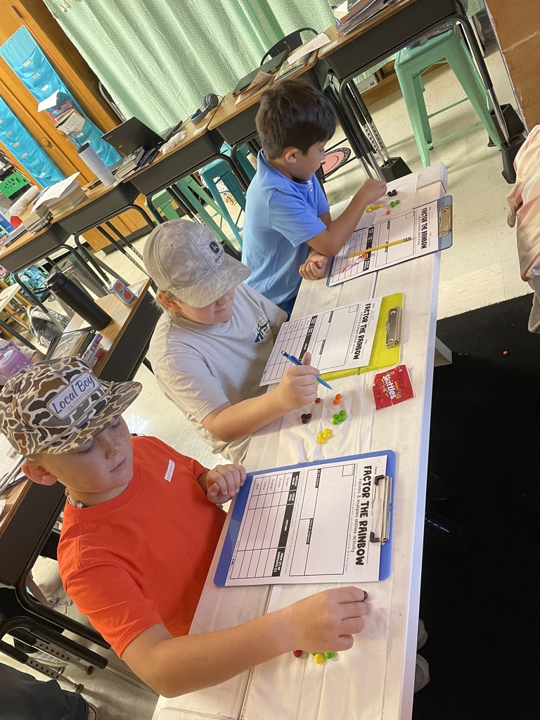 Omega Elementary School 4th graders practicing math skills.