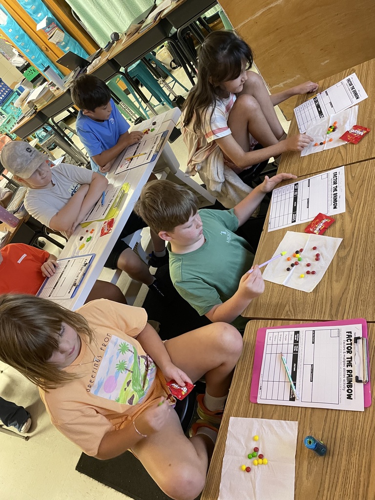 Omega Elementary School 4th graders practicing math skills.