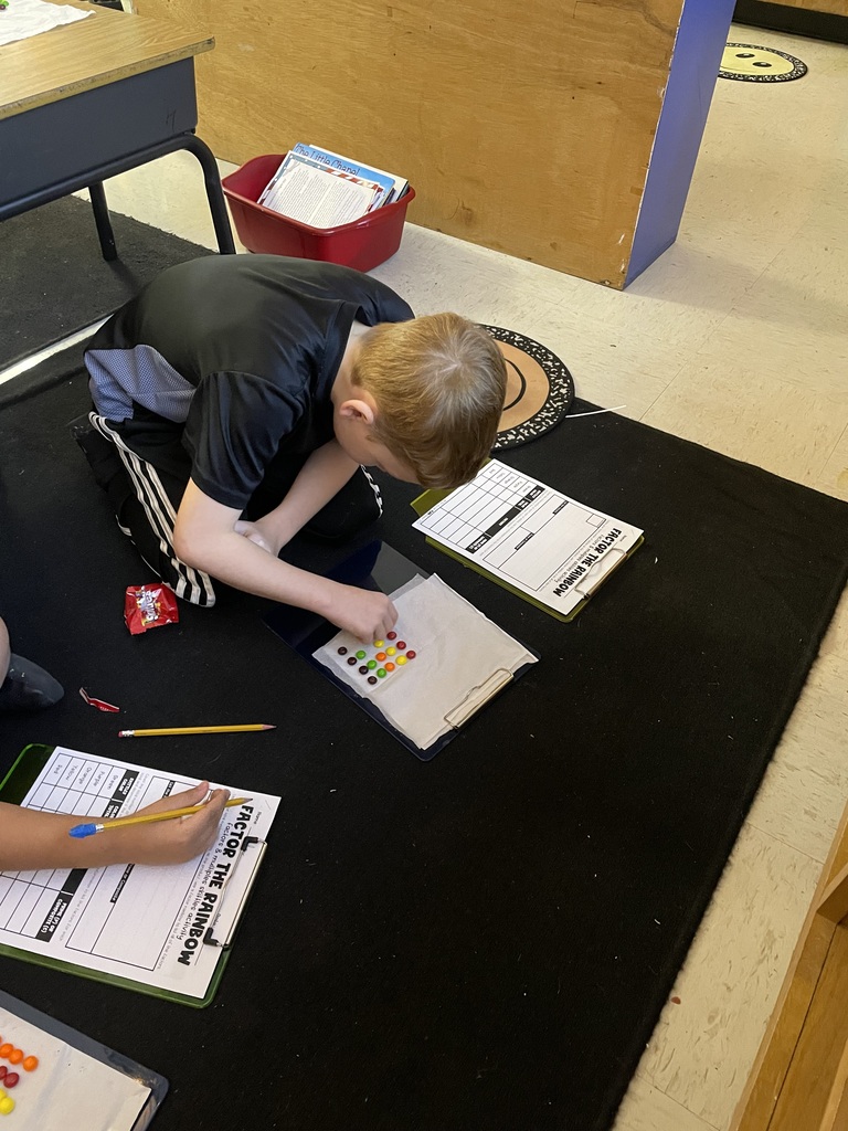 Omega Elementary School 4th graders practicing math skills.