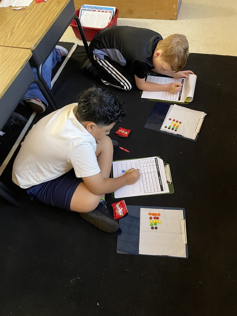 Omega Elementary School 4th graders practicing math skills.