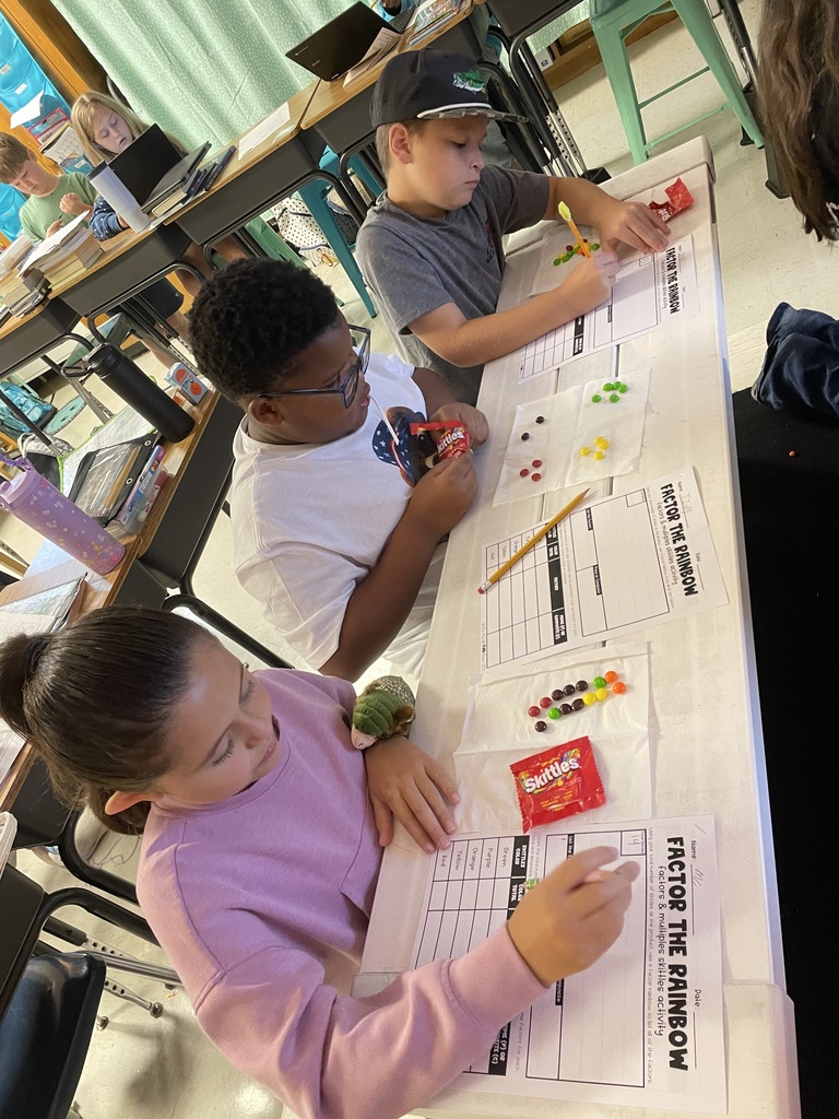 Omega Elementary School 4th graders practicing math skills.