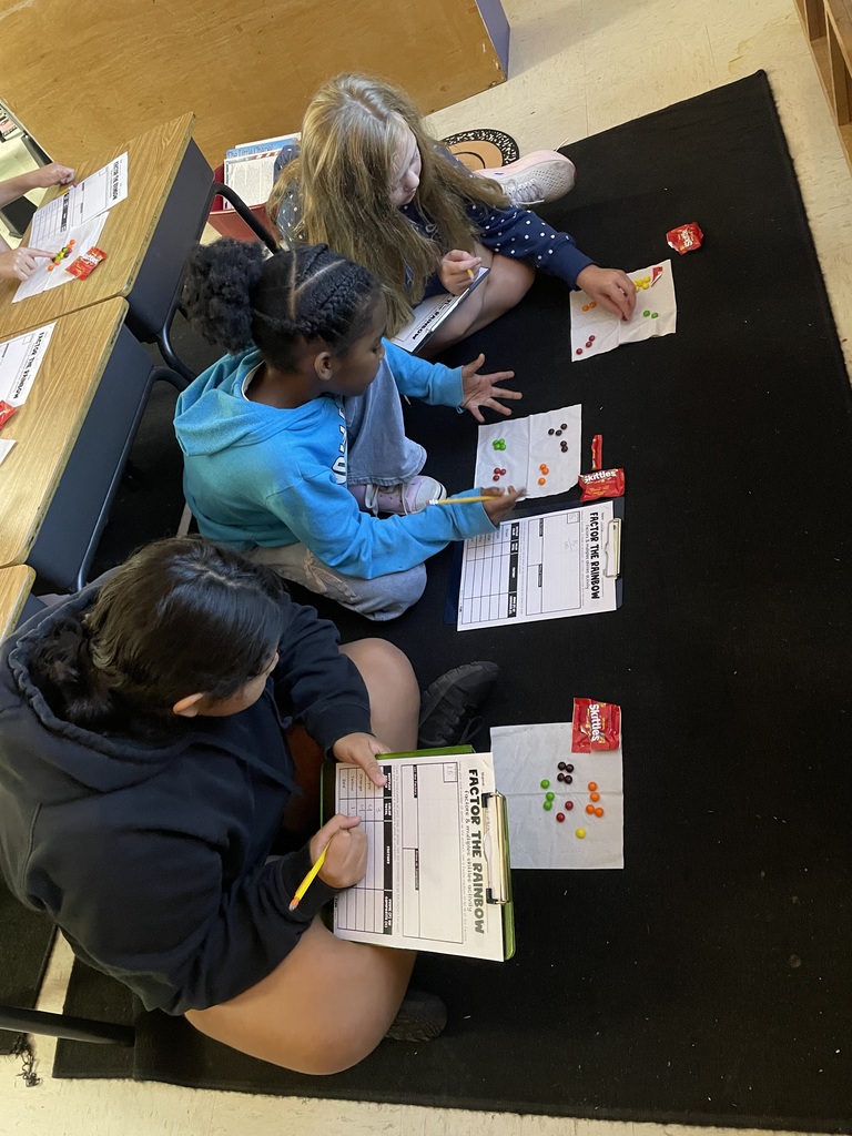 Omega Elementary School 4th graders practicing math skills.