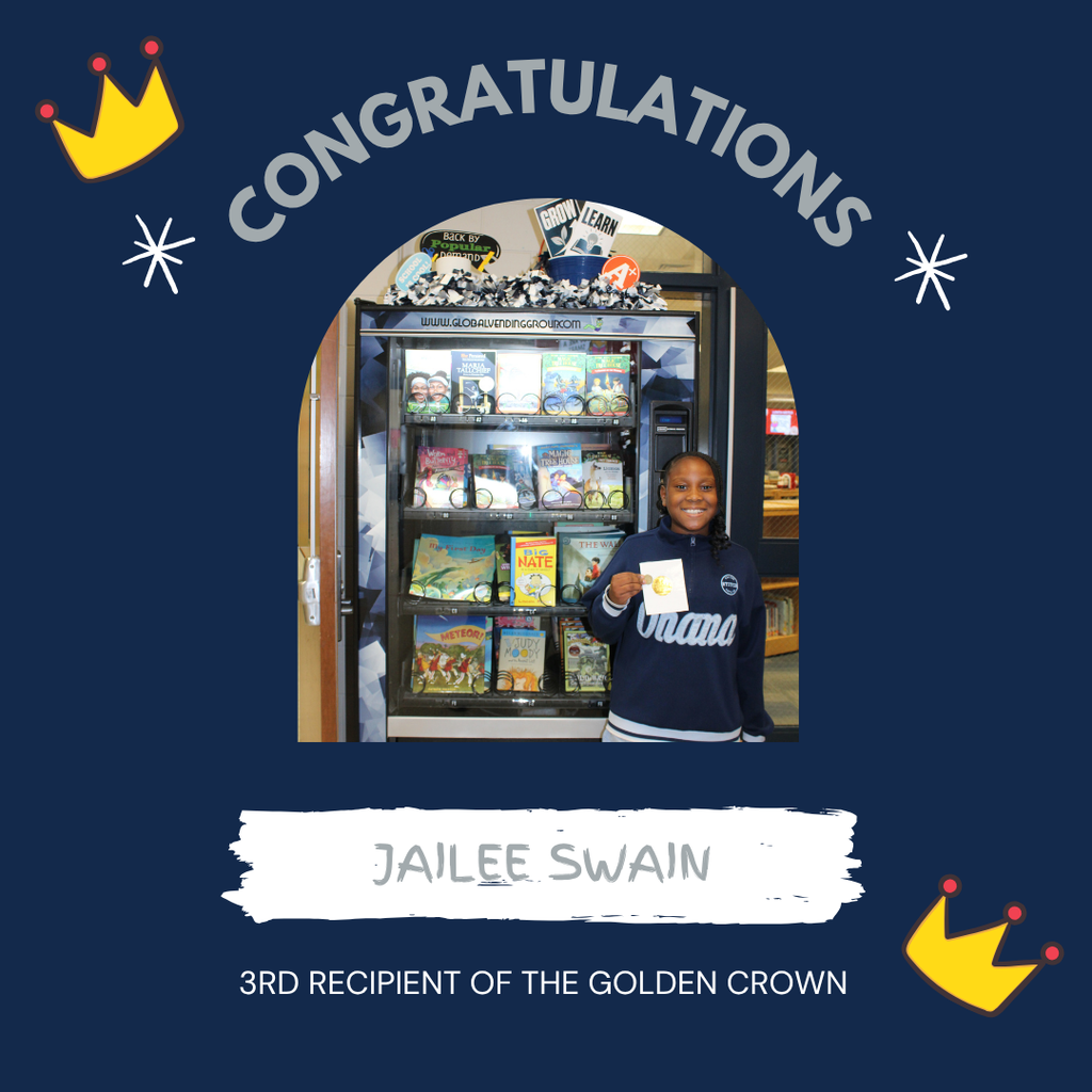 Omega Elementary School golden crown recipient for a free book from the vending machine.