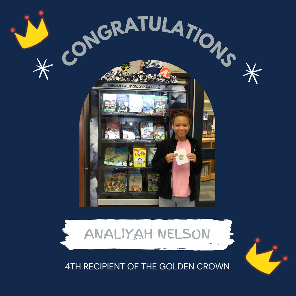Omega Elementary School golden crown recipient for a free book from the vending machine.