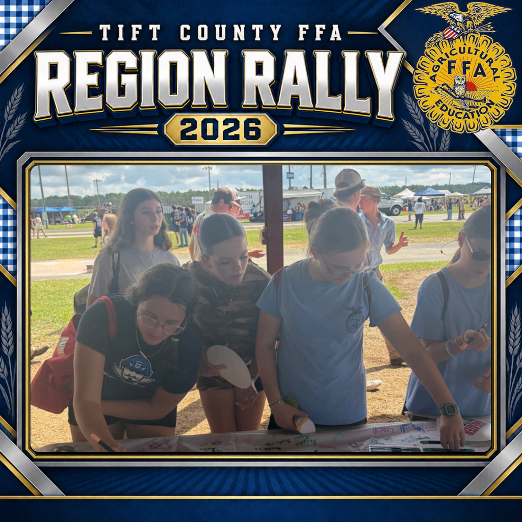 Tift County FFA Region Rally 2026 graphic showing a group of ESMS students gathered around an activity table. Several students write and draw messages on a large paper banner while others watch.
