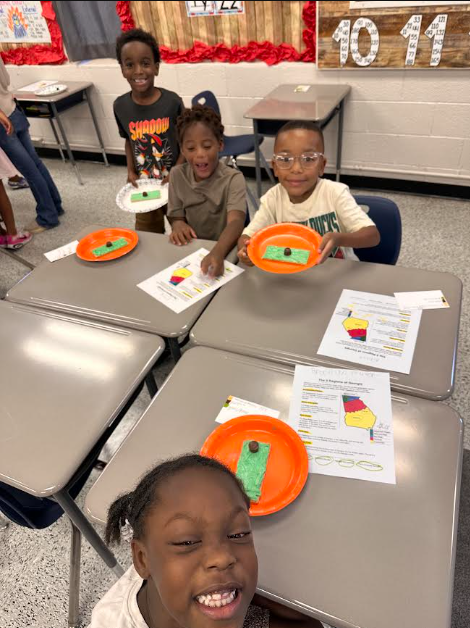 It was a FUN FRIDAY in Mrs. Smith’s 2nd Grade classroom! Today, students had a blast reviewing text features and Georgia’s 5 Regions! To bring our learning to life, students created their very own Appalachian Plateau models! 🏔️ They used Graham Crackers to represent the land, green icing for the grass and trees, and Rolos to represent the plateau.Our 2nd graders had so much fun learning, creating, and showing what they know! 💚📖🍫