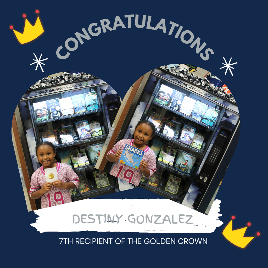 Omega Elementary School golden crown recipient for a free book from the vending machine.