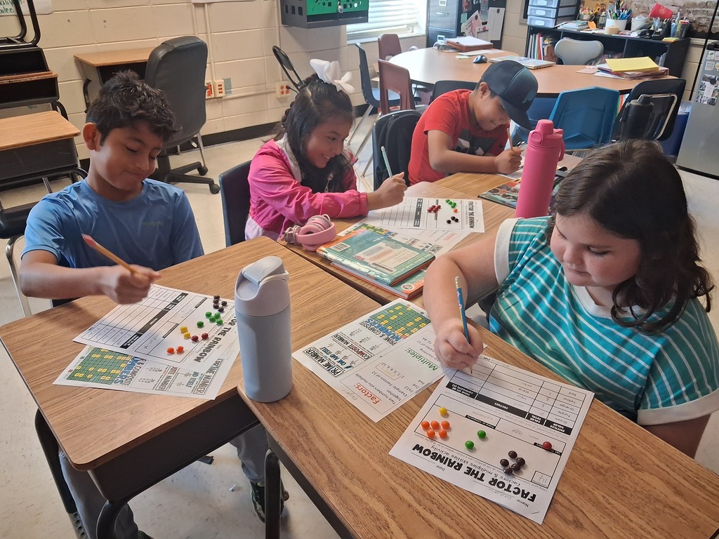 Omega Elementary School students practicing math skills.