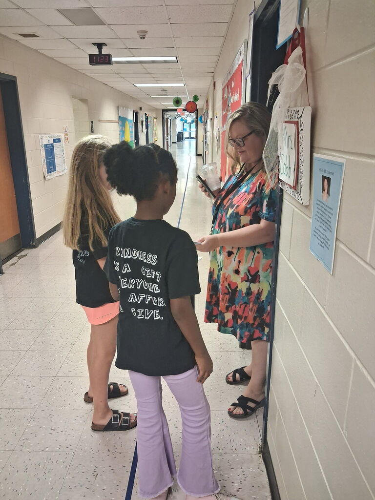 Omega Elementary School Kindness Squad spreading color. 