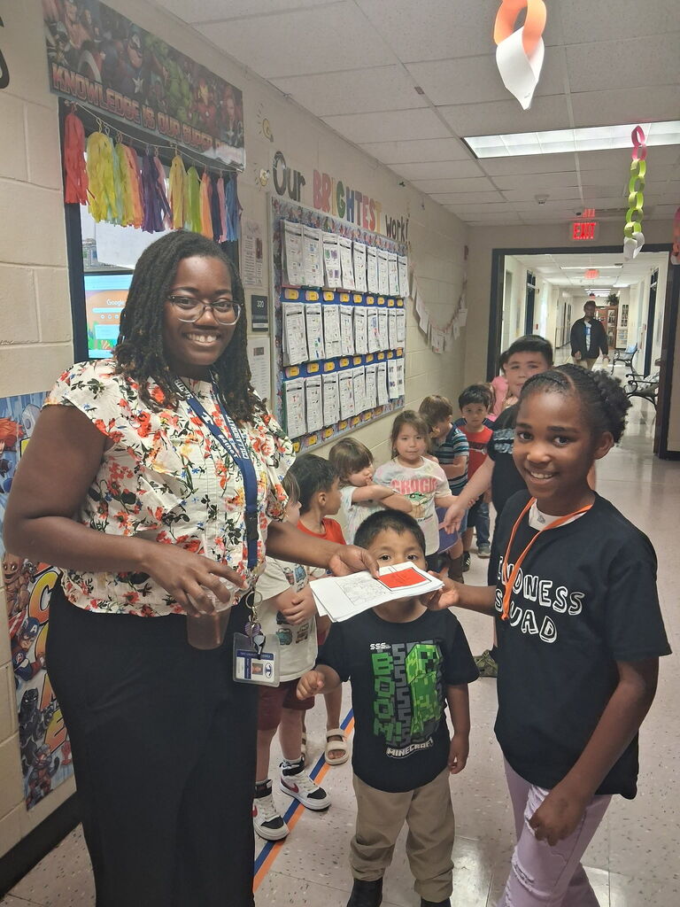 Omega Elementary School Kindness Squad spreading color. 