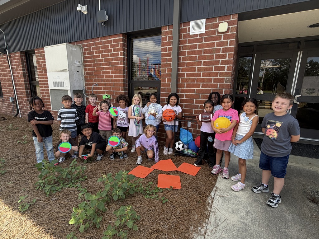 Omega Elementary students playing with new recess equipment. 