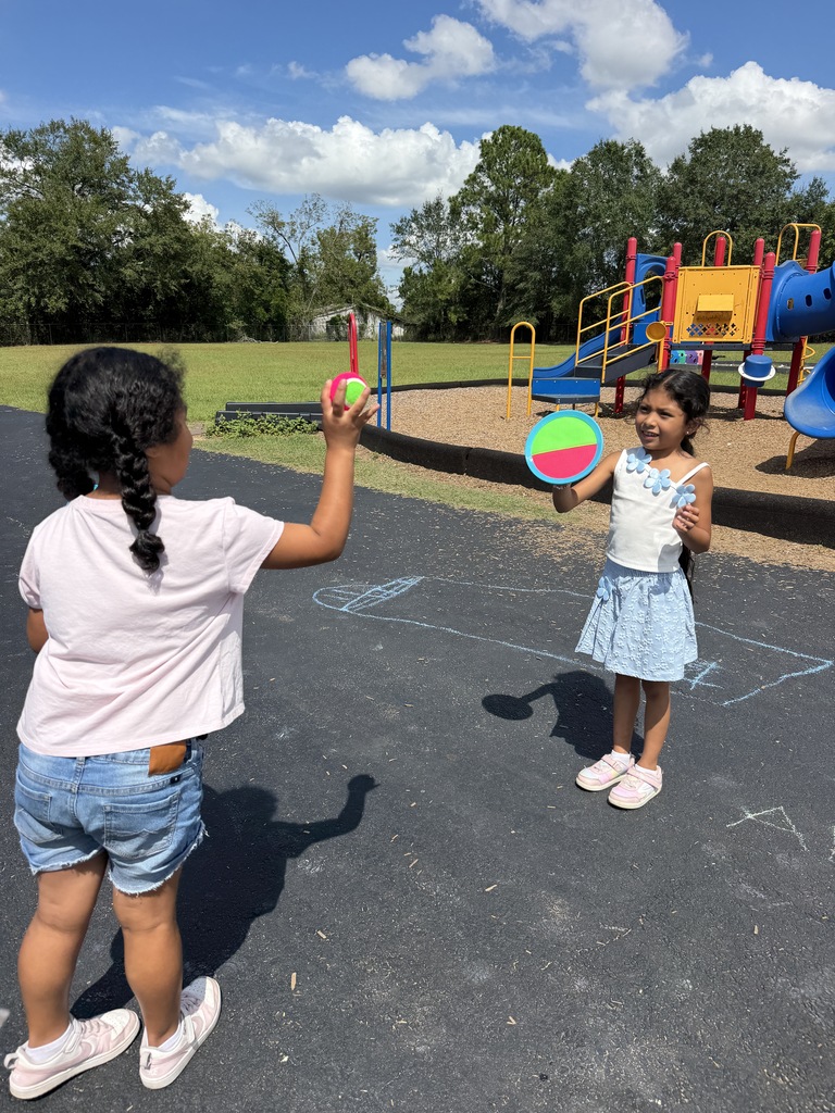 Omega Elementary students playing with new recess equipment. 