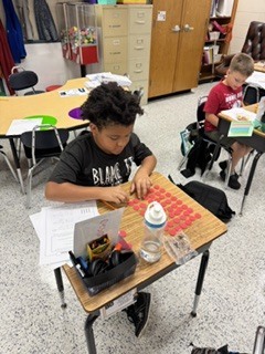 Omega Elementary School 3rd graders practicing multiplication.