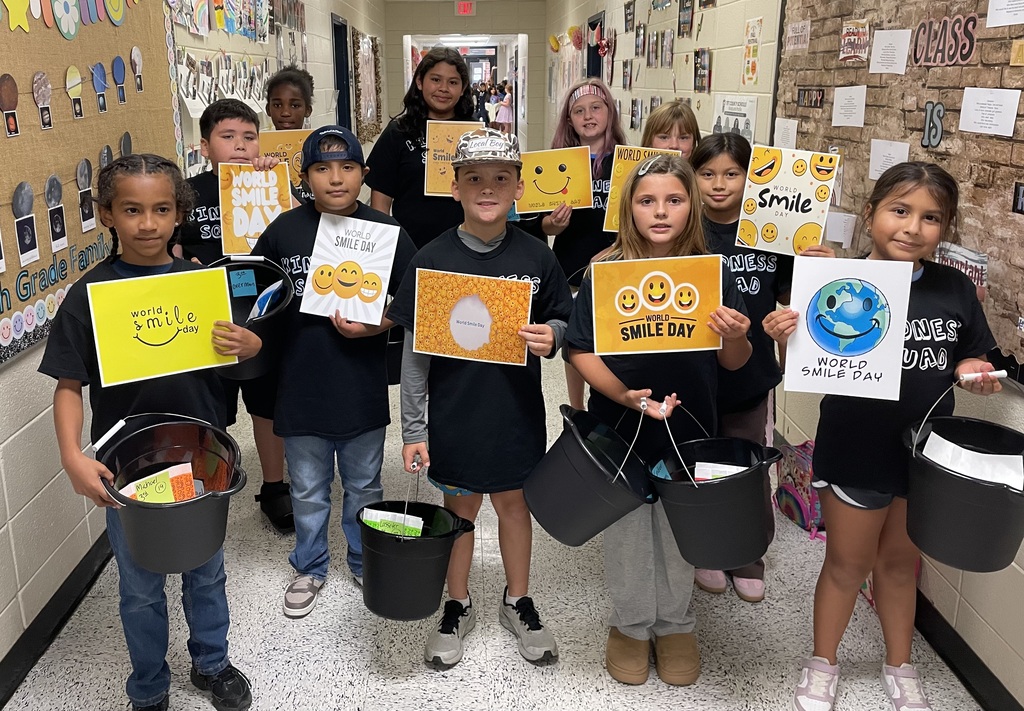 Omega Elementary School Kindness Squad delivering smiles on world smile day.