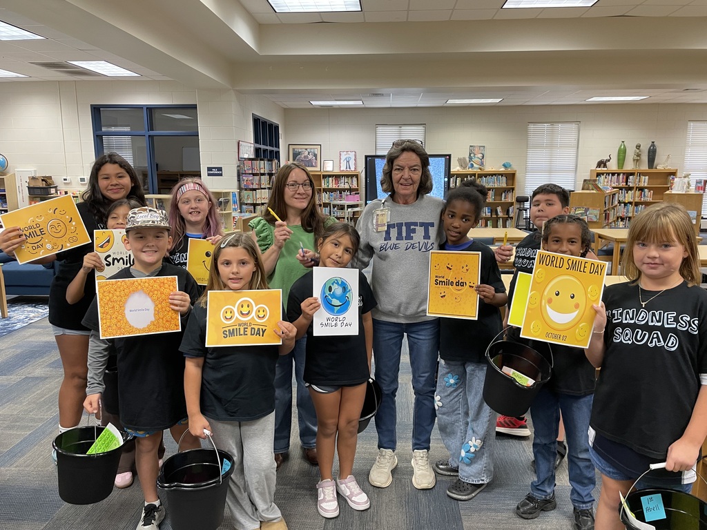 Omega Elementary School Kindness Squad delivering smiles on world smile day.