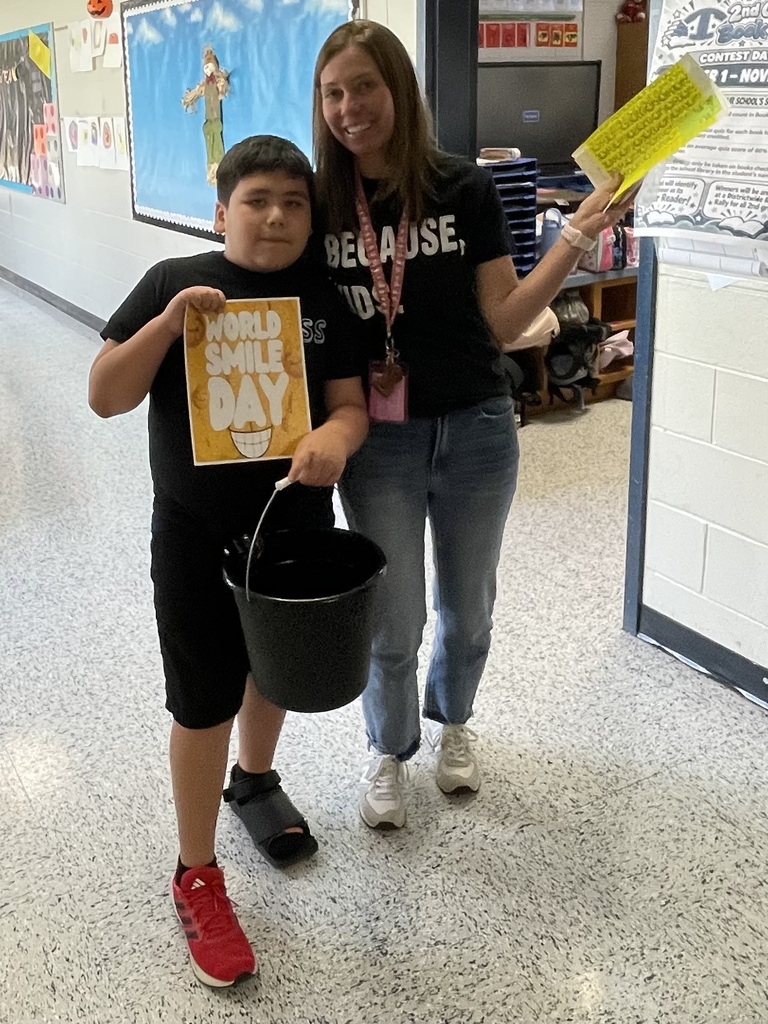 Omega Elementary School Kindness Squad delivering smiles on world smile day.