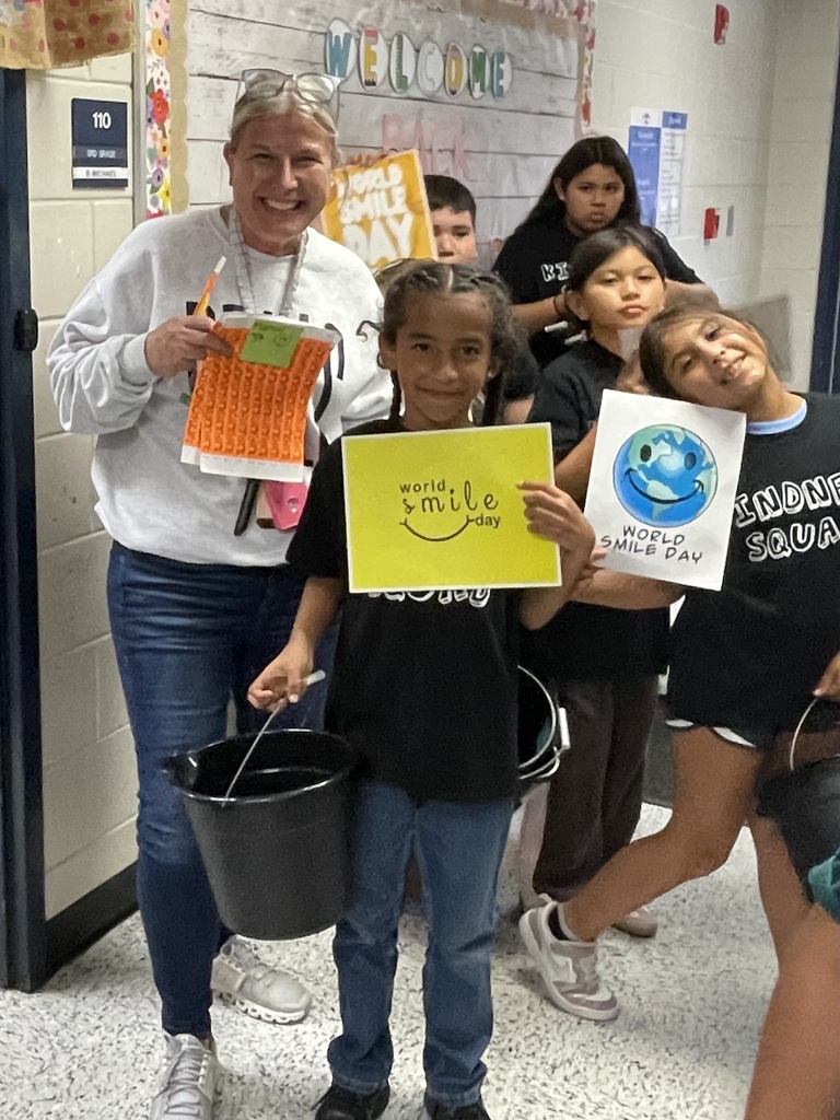 Omega Elementary School Kindness Squad delivering smiles on world smile day.