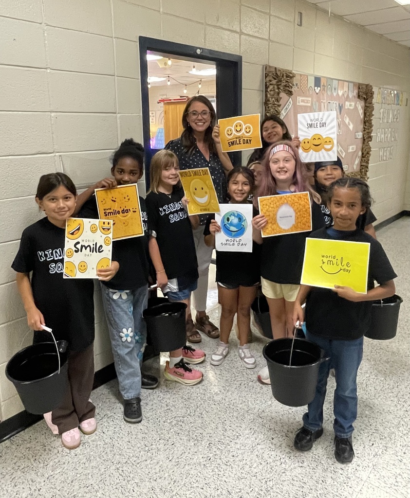 Omega Elementary School Kindness Squad delivering smiles on world smile day.