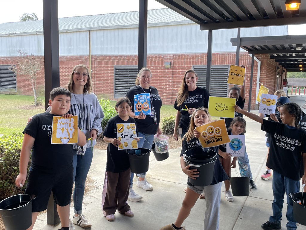 Omega Elementary School Kindness Squad delivering smiles on world smile day.