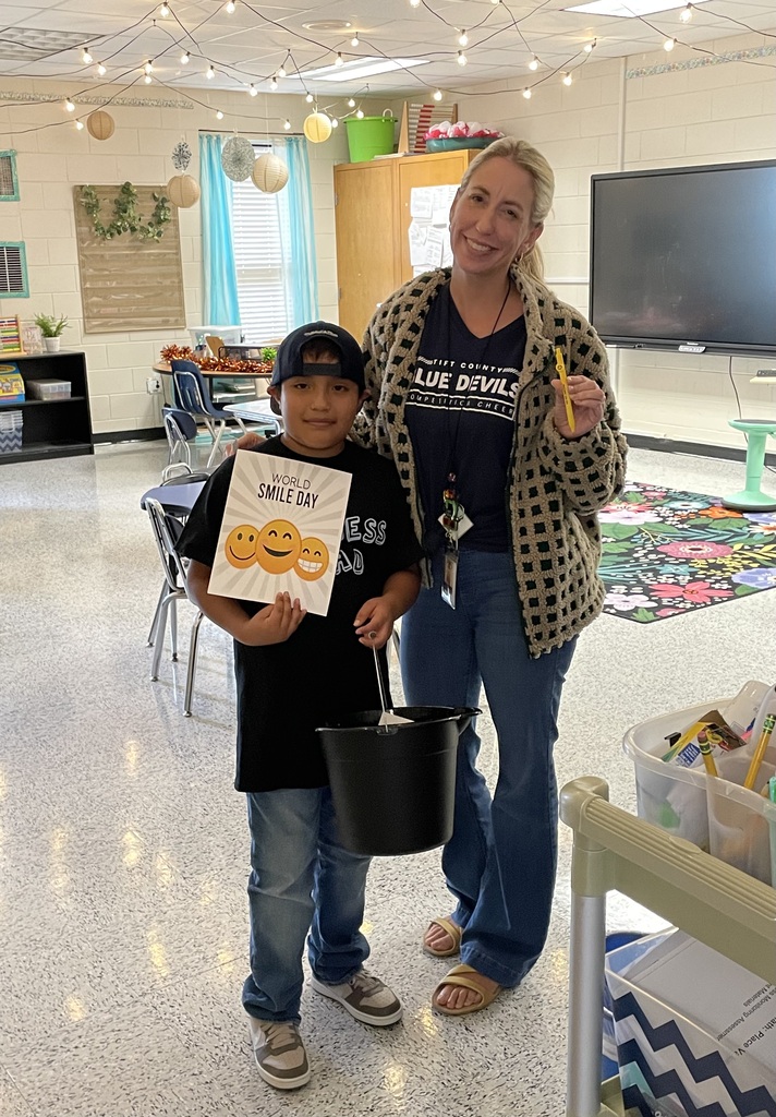 Omega Elementary School Kindness Squad delivering smiles on world smile day.