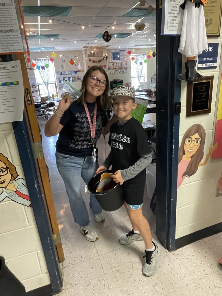 Omega Elementary School Kindness Squad delivering smiles on world smile day.