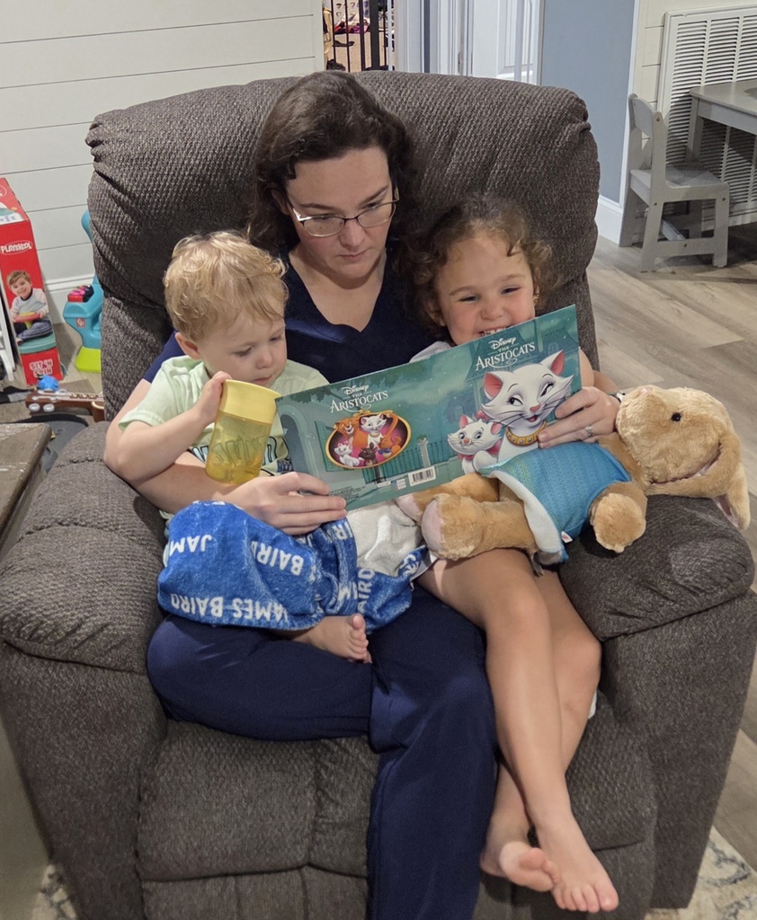 Omega Elementary School students reading at home. 