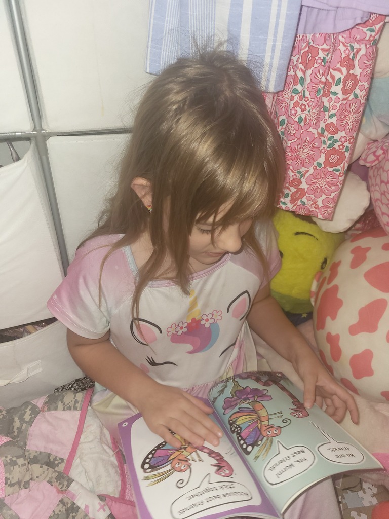 Omega Elementary School students reading at home. 