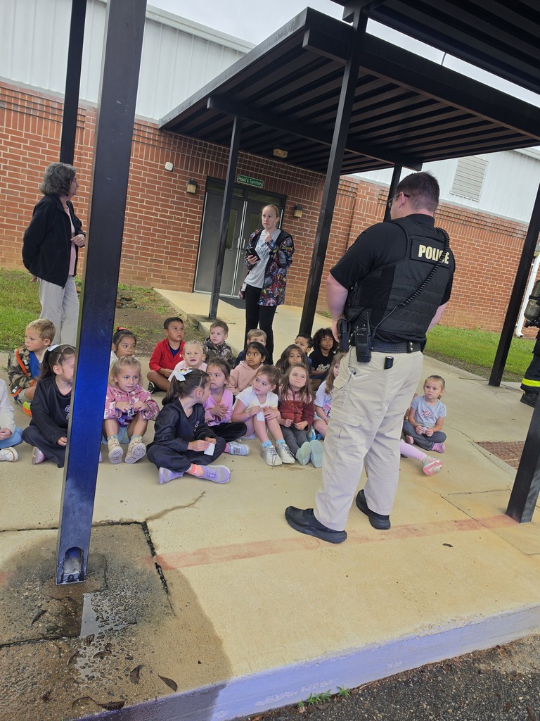 Students learning about being a police officer.