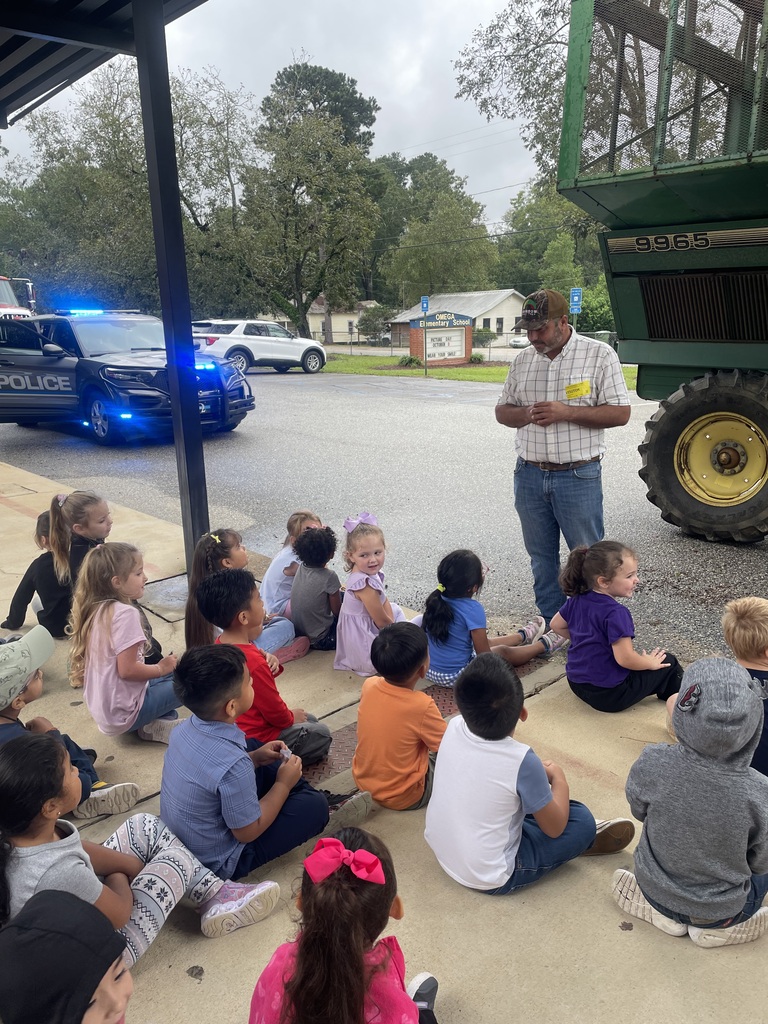 Farmer speaking with students about commnity helpers.