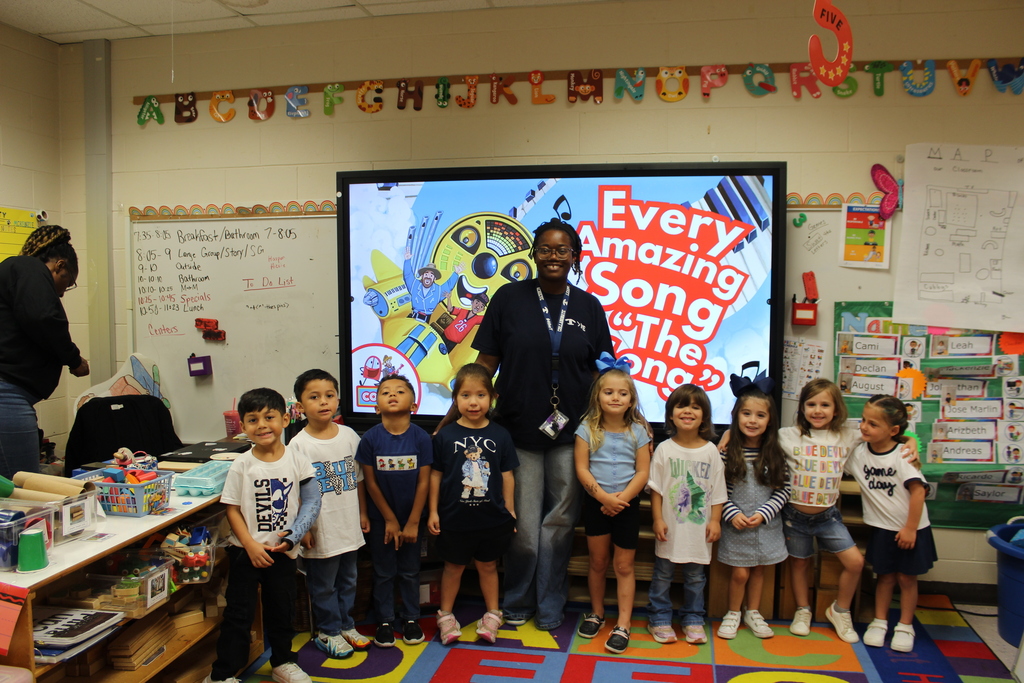 Staff and students at Omega Elementary wearing blue and white for spirit day!