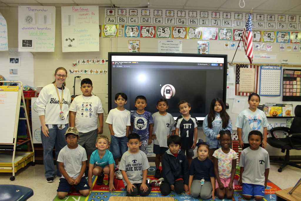 Staff and students at Omega Elementary wearing blue and white for spirit day!