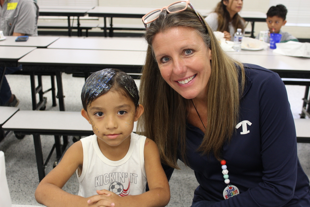 Staff and students at Omega Elementary wearing blue and white for spirit day!