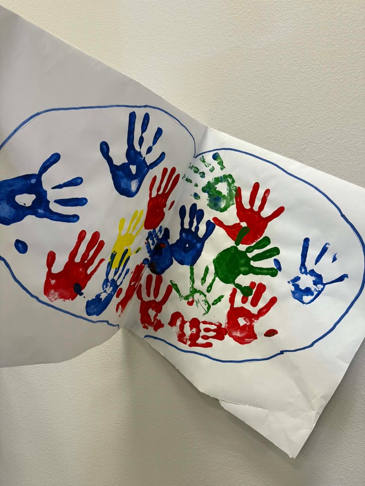 students handprints inside of a heart
