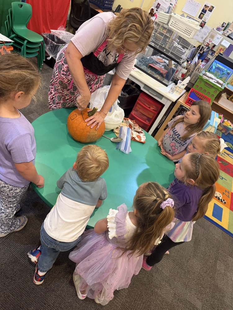 pre-K carving a pumpkin 