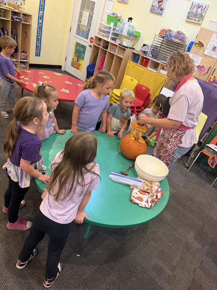 pre-K carving a pumpkin 