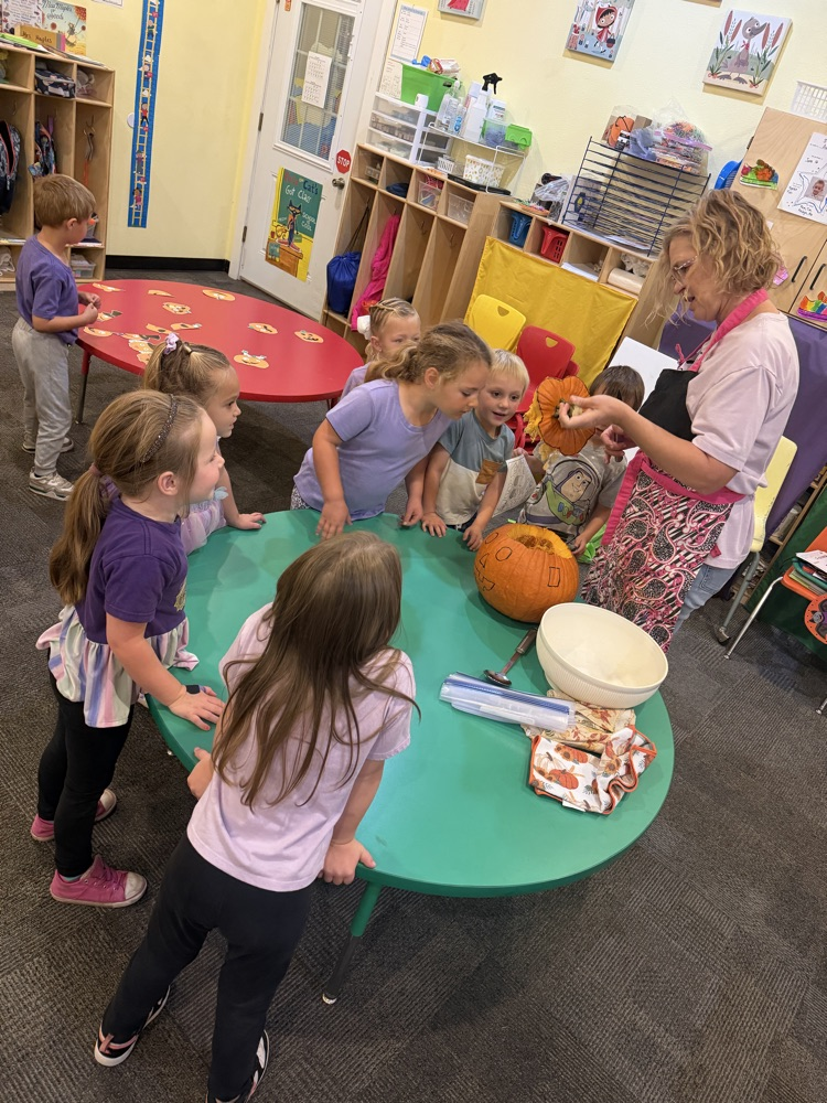 pre-K carving a pumpkin 
