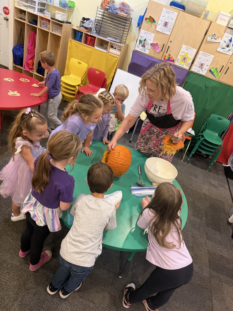 pre-K carving a pumpkin 