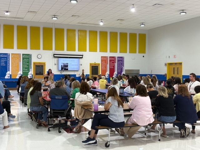 MFA Staff in the cafeteria attending a meeting