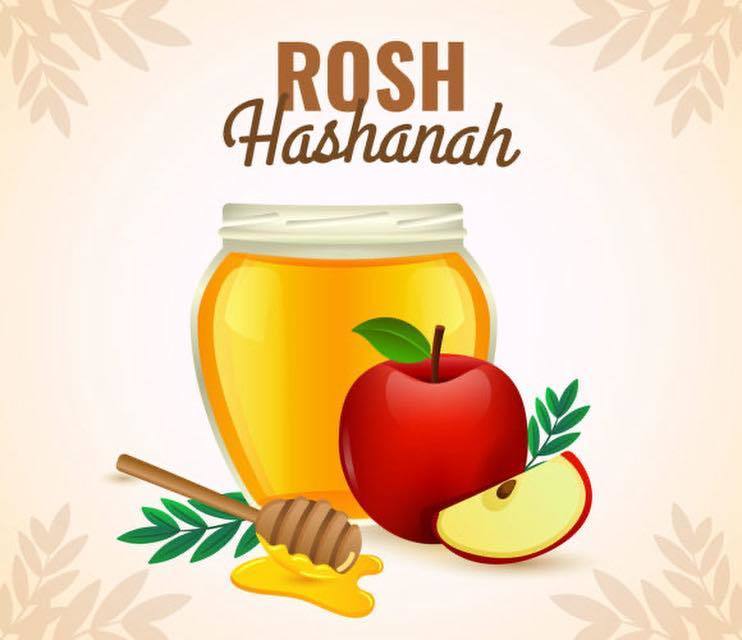 Image of honey and an apple with Rosh Hashanah written