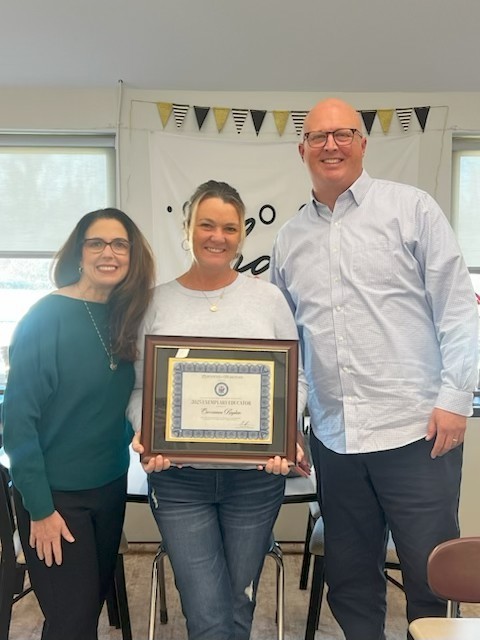 Picture of Dr. Goldey, Mrs. Kaplan, and Mr. Howroyd with award