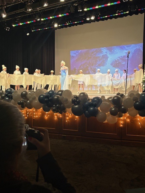 Students on stage performing Frozen Kids