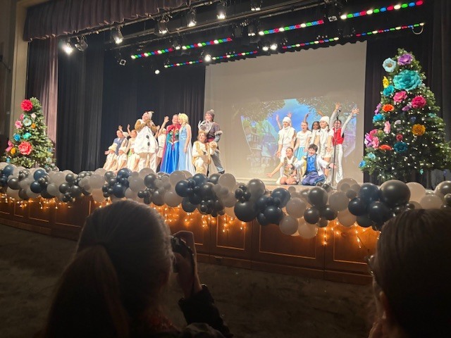 Students on stage performing Frozen Kids