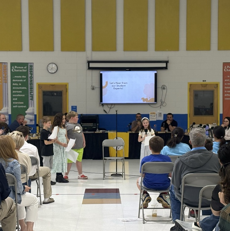 picture of students presenting at board meeting 