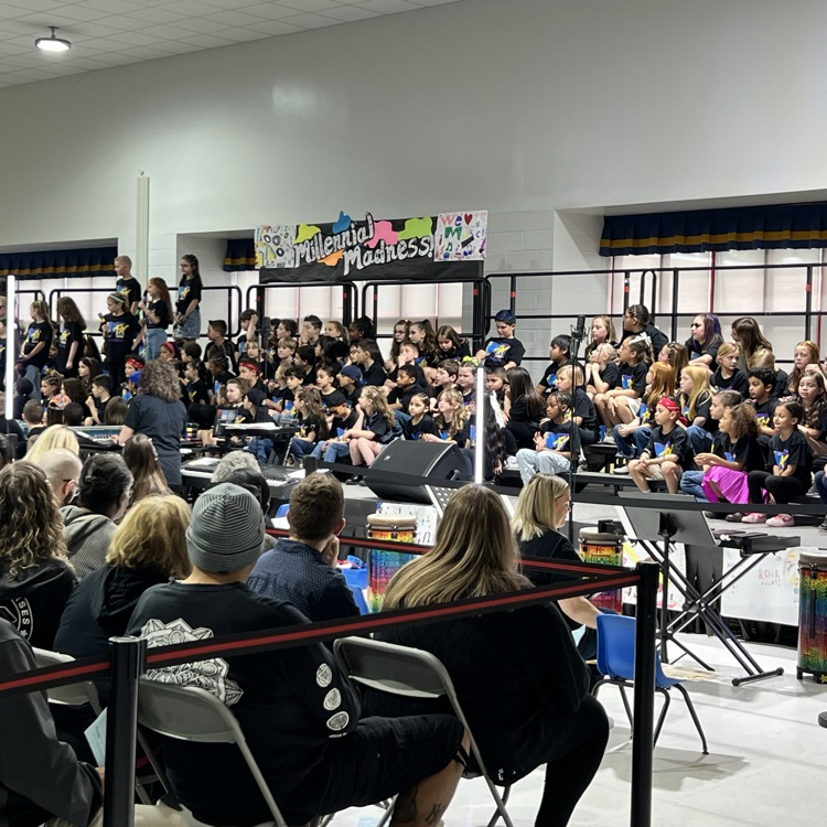 students sitting on a risers  