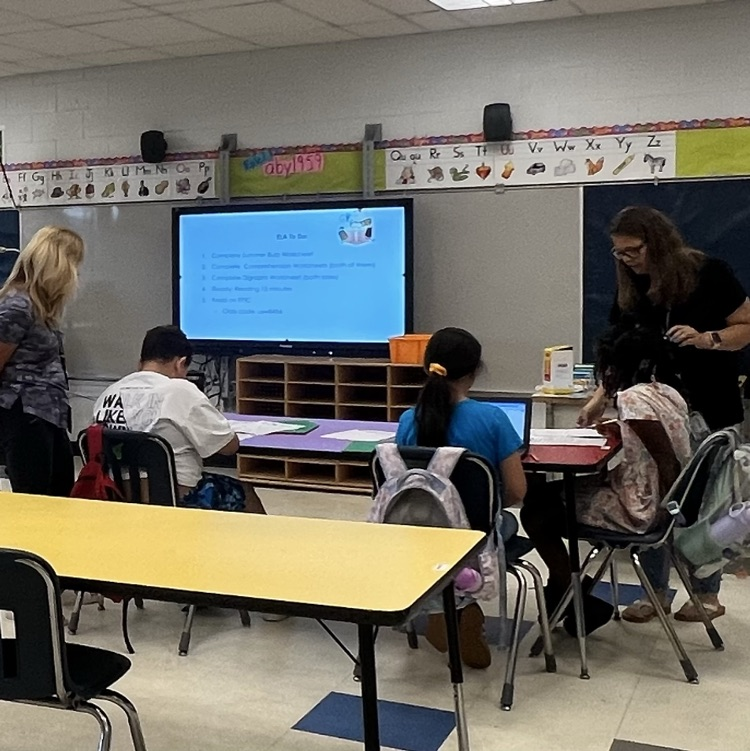 teachers and students in a classroom 