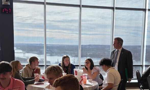 Governor Armstrong speaking with senior students.