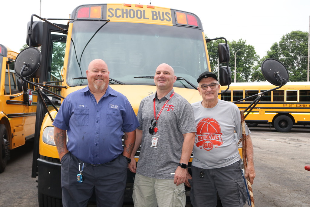 Bus mechanic with his right hand man and superintendent.
