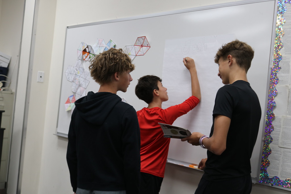 TMS students in ELA work on a project.